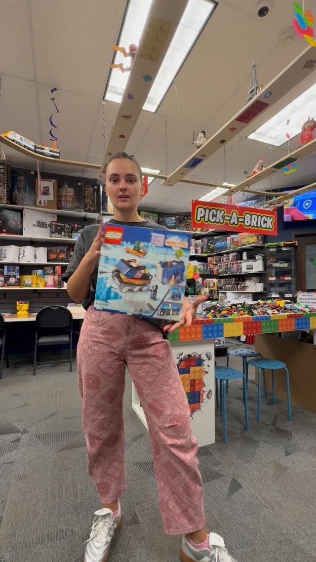 A vintage LEGO set being shown inside Romo's Bricks